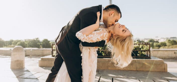 Groom Kissing Bride's Neck