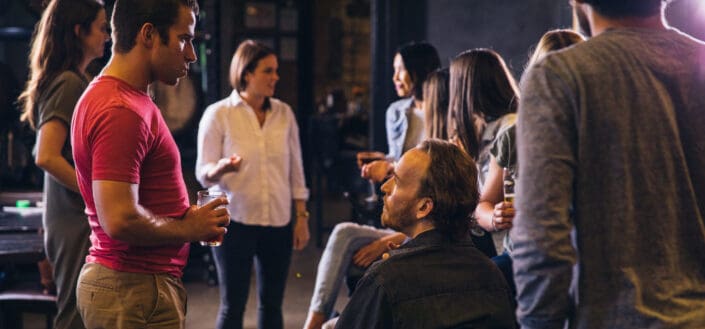 Group of People Drinking and Talking