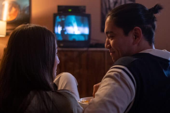 Couple Watching TV on The Couch