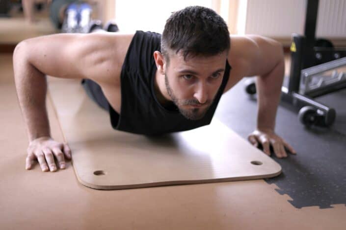 Man in Tank Top Doing Push Ups