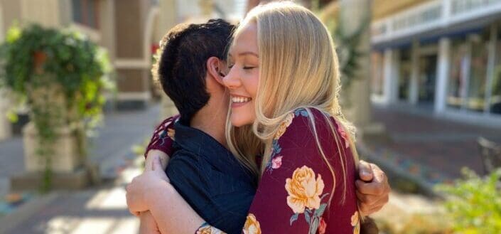 couple doing friendly hug