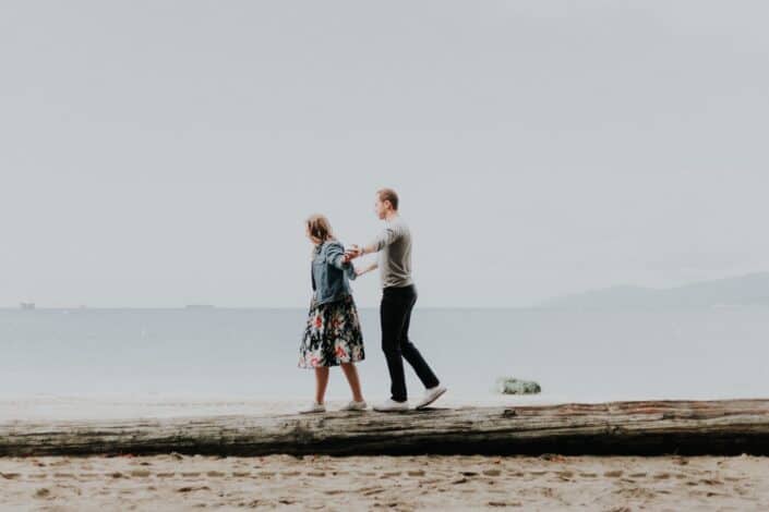 couple walking by the beach