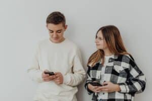 A couple holding phones