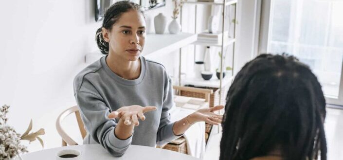 Couple Having a Discussion at the Table