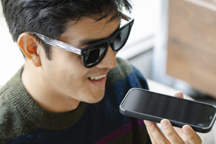 man happily talking on phone