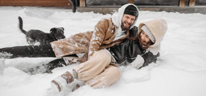 a couple having fun in the snow