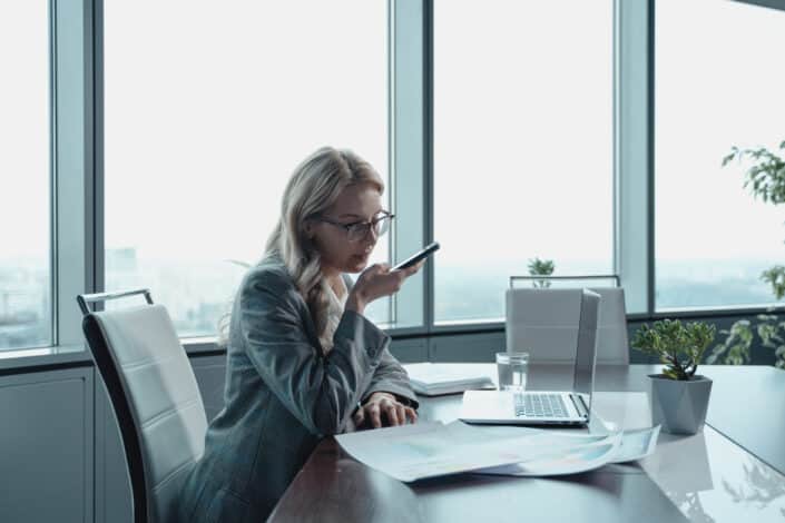 a woman talking on the phone while working