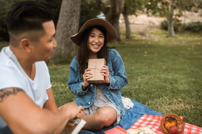 a couple enjoying a picnic in the park