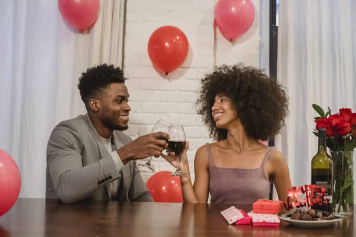 Cheerful couple with wine glasses