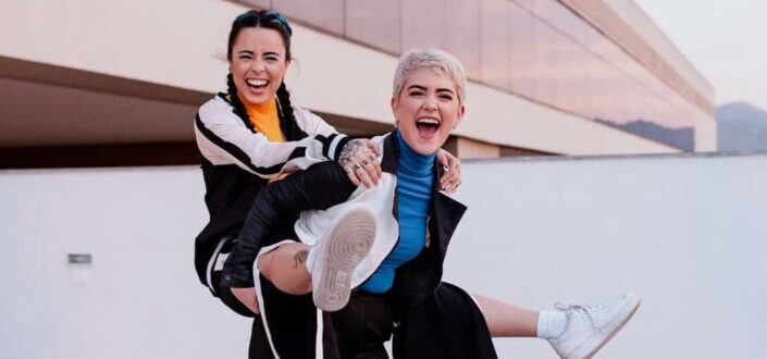 Cheerful Woman Giving Piggyback Ride to Her Friend