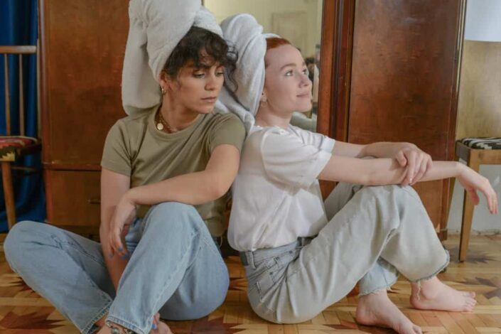 Friends Sitting on the Floor Next to Each Other