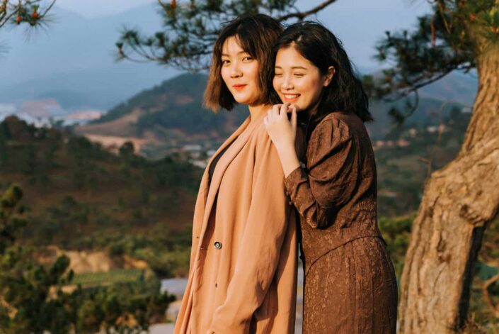 Two Girls Wearing Brown Dresses