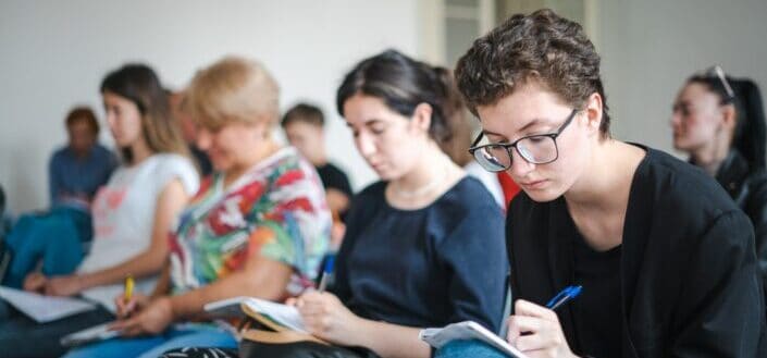 Students Taking Down Notes