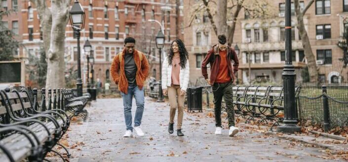 Stylish Teenagers Walking in City Park and Chatting