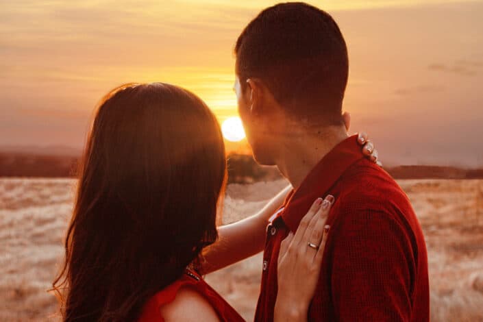 Unrecognizable couple admiring sunset