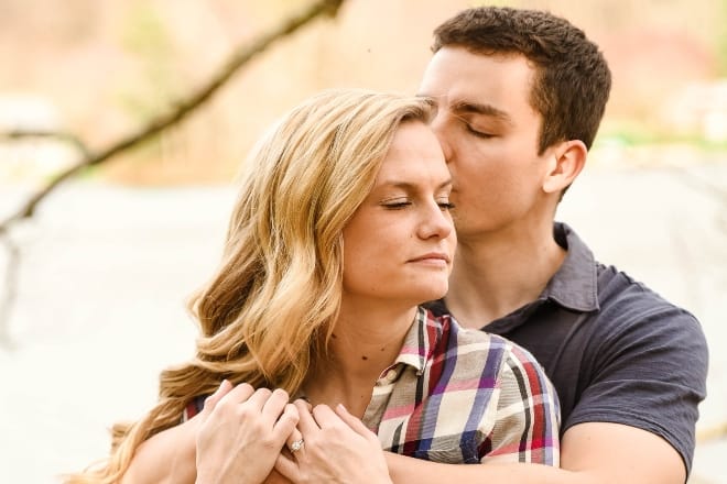 A couple hugging and comforting each other - How To Make Someone Feel Better