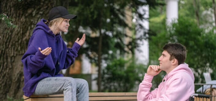 A couple talking at the park