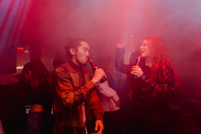 Man and Woman Partying at the Club While Drinking Beer