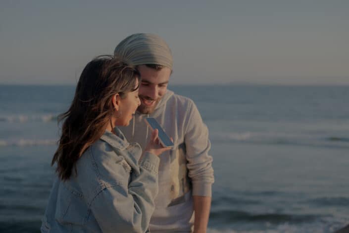 A man and woman talking on the phone together