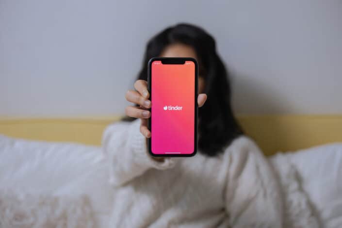 A woman showing her smartphone
