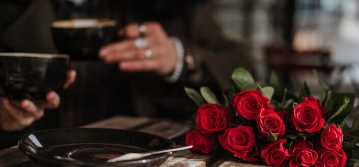 Bouquet of roses placed on table