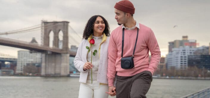 Cheerful couple walking on street