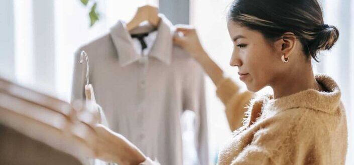 Concentrated Woman Picking Out Clothes