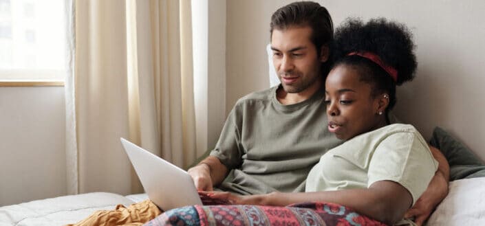 couple watching on their laptop