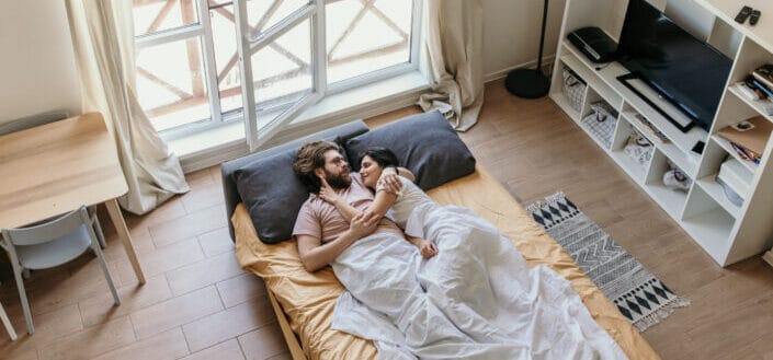Couple lying on bed