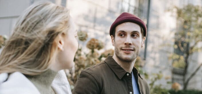 Happy couple on street in sunny day