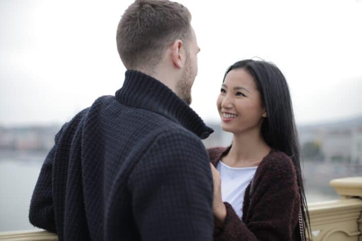 Happy Couple Standing on the Bridge