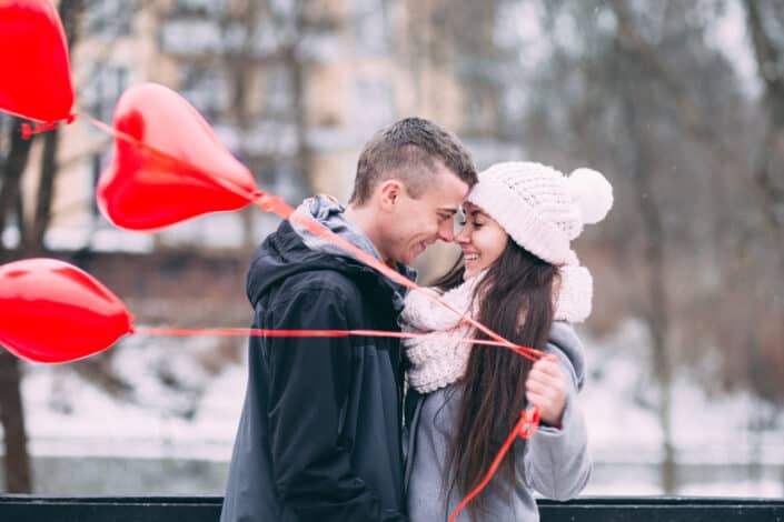 Happy couple in city during winter