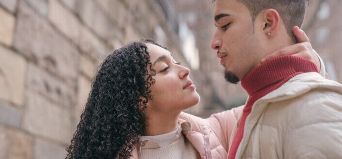 Loving couple hugging on street