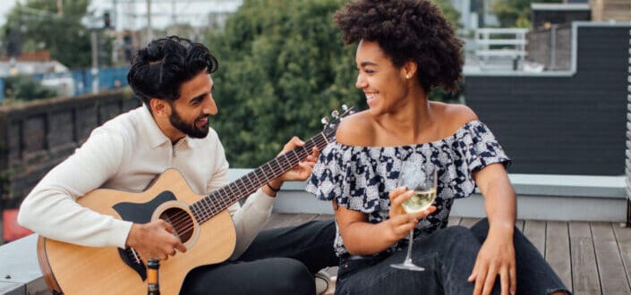 Man and woman sitting on the rooftop