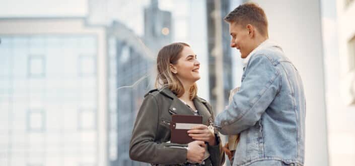 Man in blue denim jacket and woman in gray coat