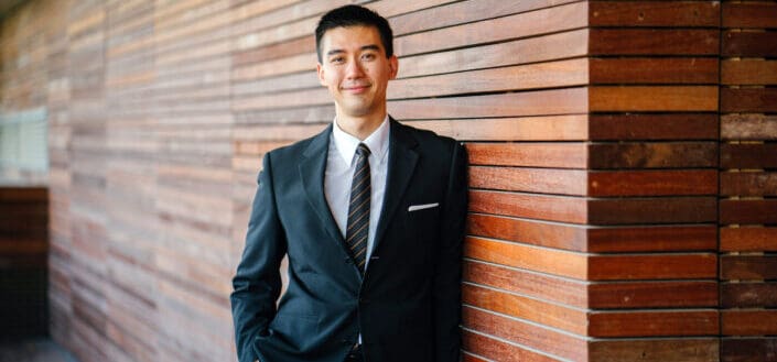 Man wearing black suit jacket and pants
