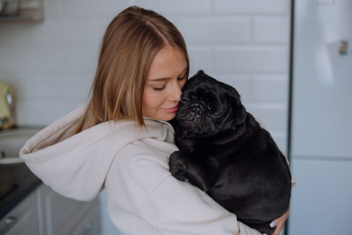 Girl Hugging Her Dog