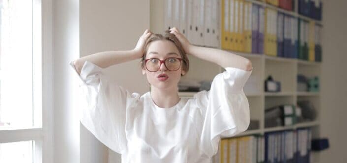 Shocked female worker in modern workplace