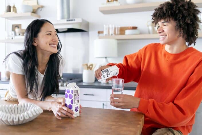 Couple happily talking in the kitchen