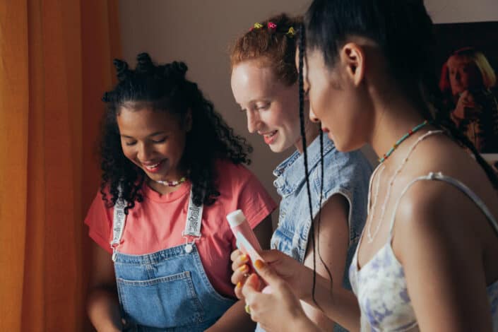 Three women looking down together