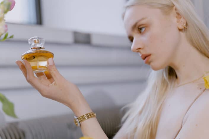 Woman holding a perfume