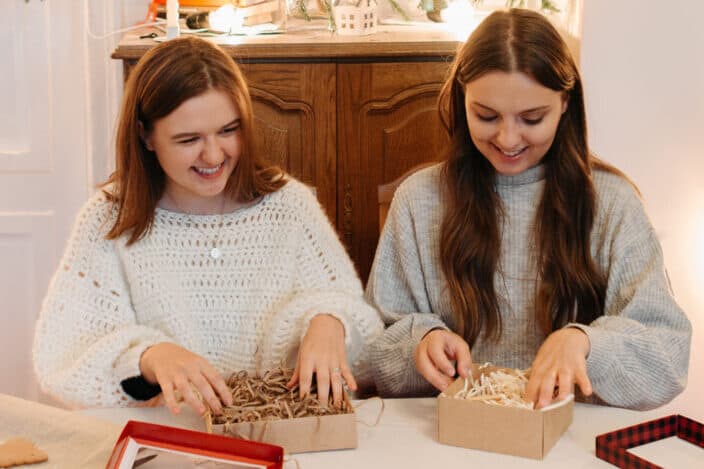 Young Girls Boxing Cookies for Holidays