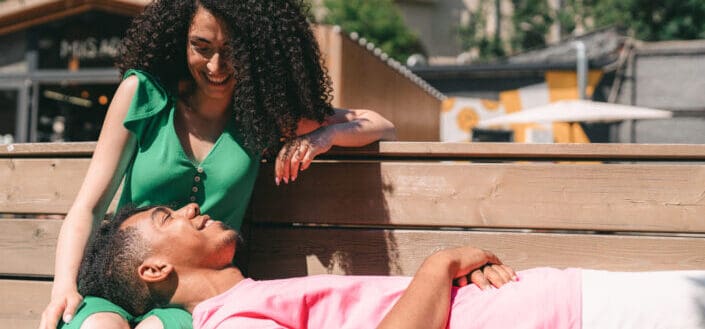 A happy couple on a bench