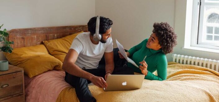 Man and Woman Talking on the Bed