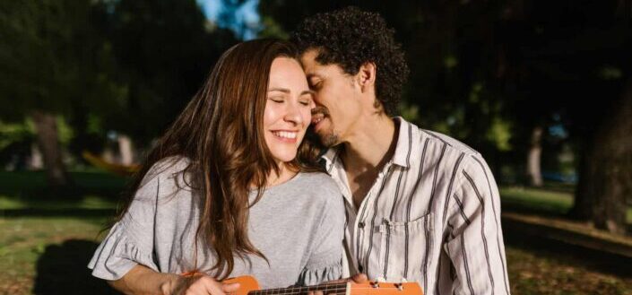 Man Whispering into a Woman's Ear