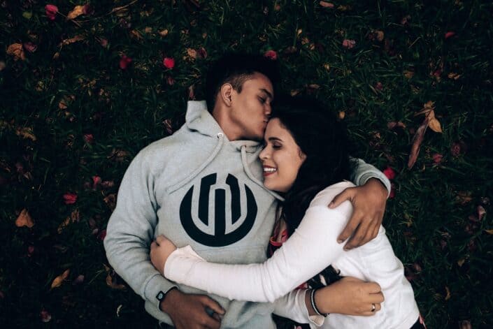 couple embracing while lying down