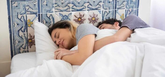 Couple sleeping in bed