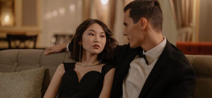 Couple wearing black suit and black dress