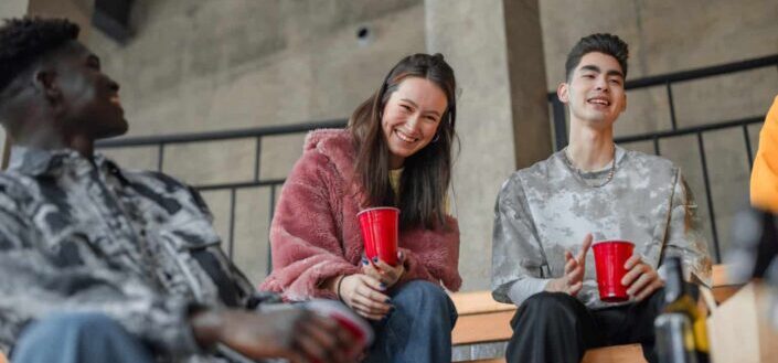 Teenagers Sitting on the Bench Laughing