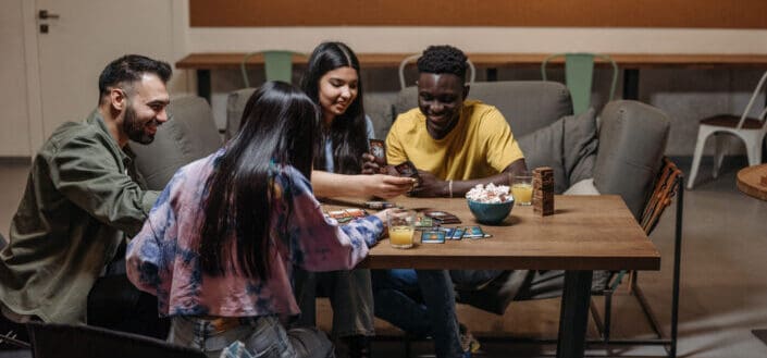 Group of friends playing card games